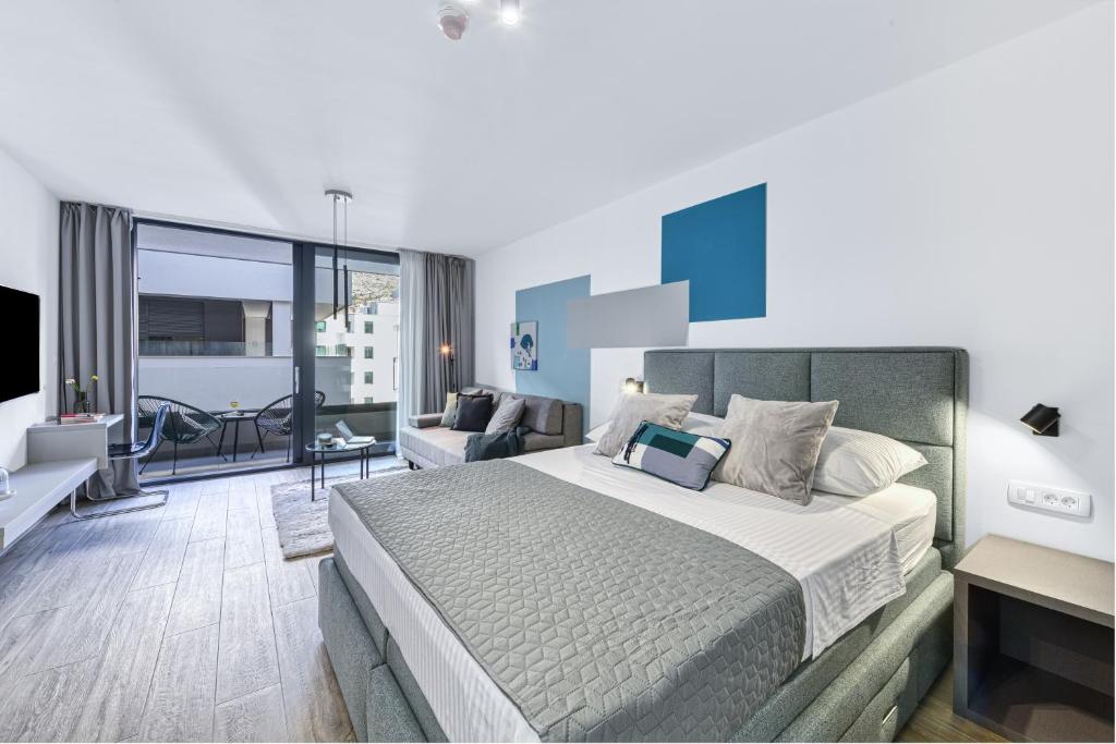 Posteľ alebo postele v izbe v ubytovaní Apartments Hica
