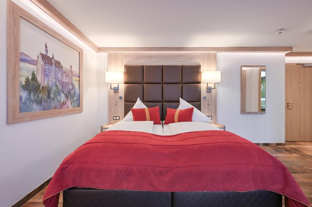 Postel nebo postele na pokoji v ubytování Hotel Ludwigs
