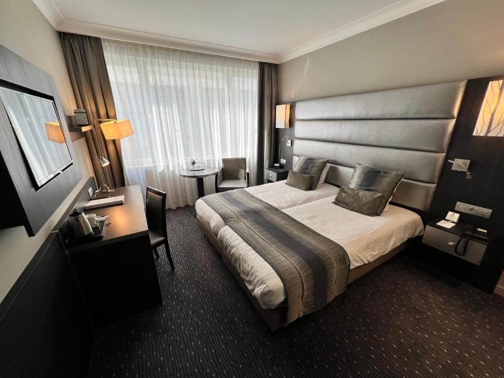 Postel nebo postele na pokoji v ubytování Best Western Hotel Royal Centre