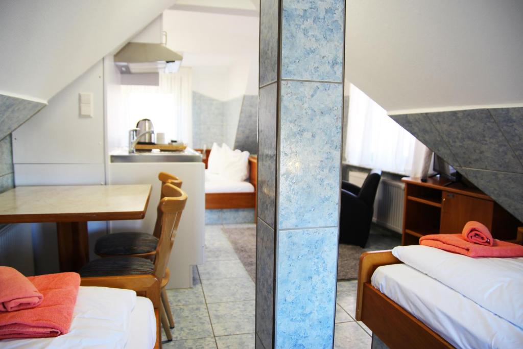 Postel nebo postele na pokoji v ubytování M-Hotel