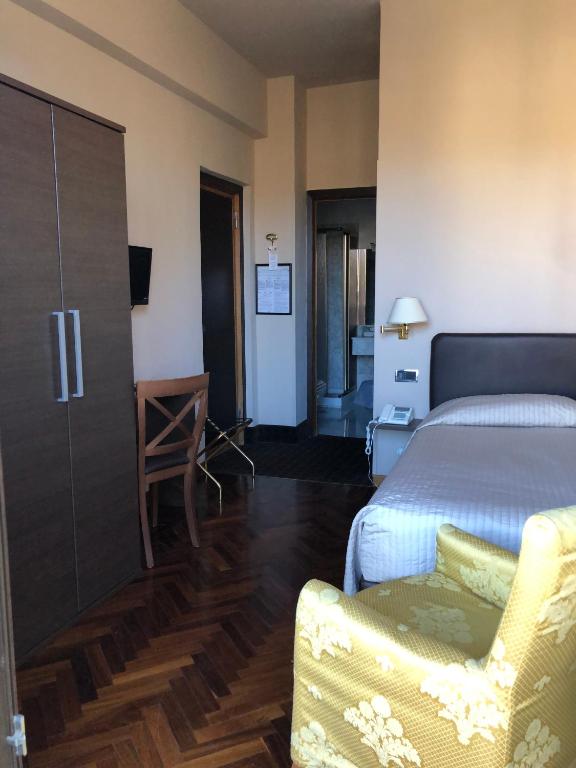 Postel nebo postele na pokoji v ubytování Hotel San Giorgio