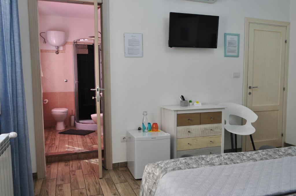 Posteľ alebo postele v izbe v ubytovaní B&B Rosa dei Venti