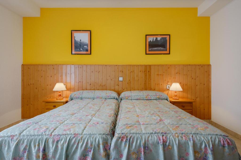 Postel nebo postele na pokoji v ubytování Hostal Kimboa