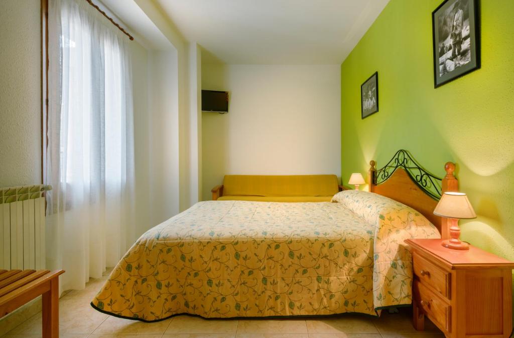 Postel nebo postele na pokoji v ubytování Hostal Kimboa