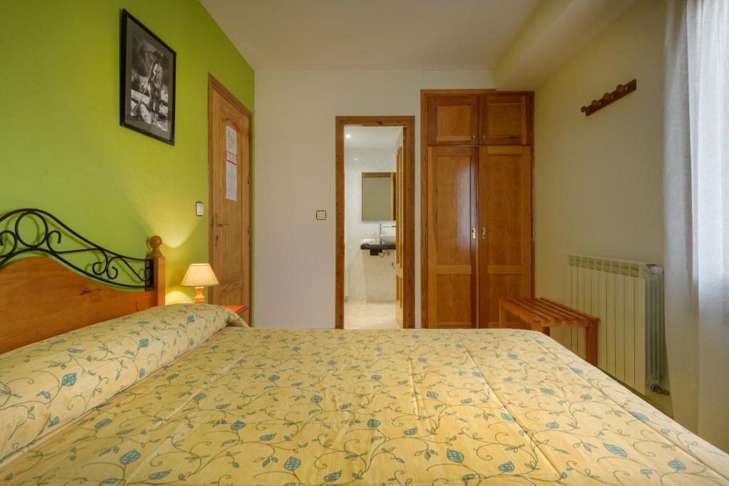 Postel nebo postele na pokoji v ubytování Hostal Kimboa