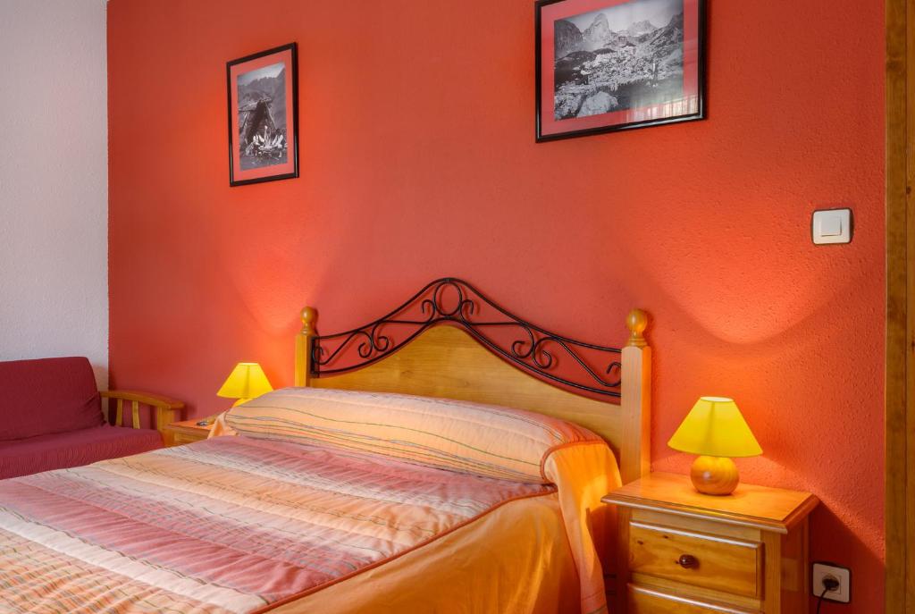 Postel nebo postele na pokoji v ubytování Hostal Kimboa