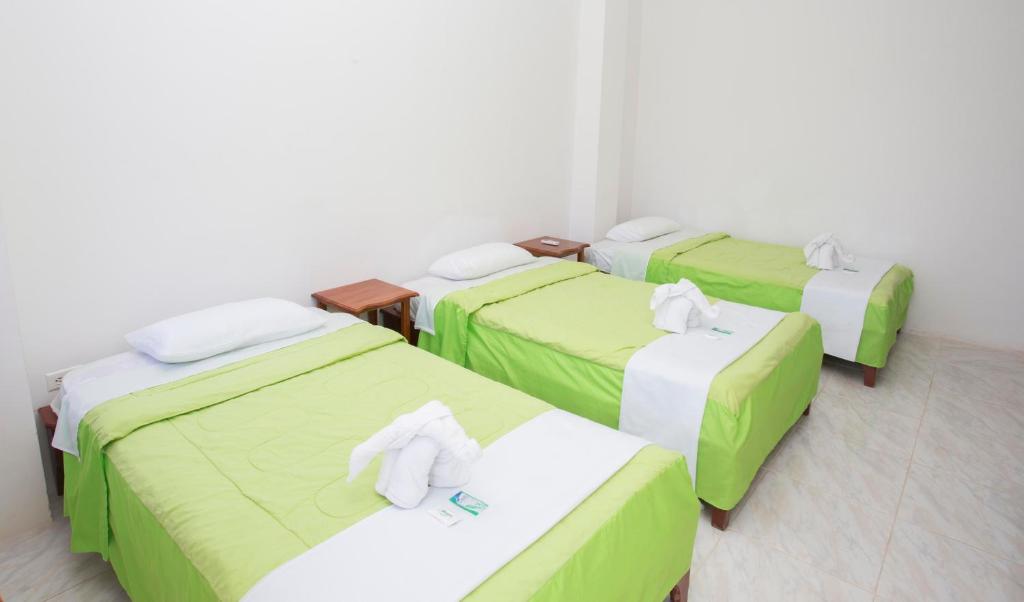 Postel nebo postele na pokoji v ubytování Paraiso de Isabela