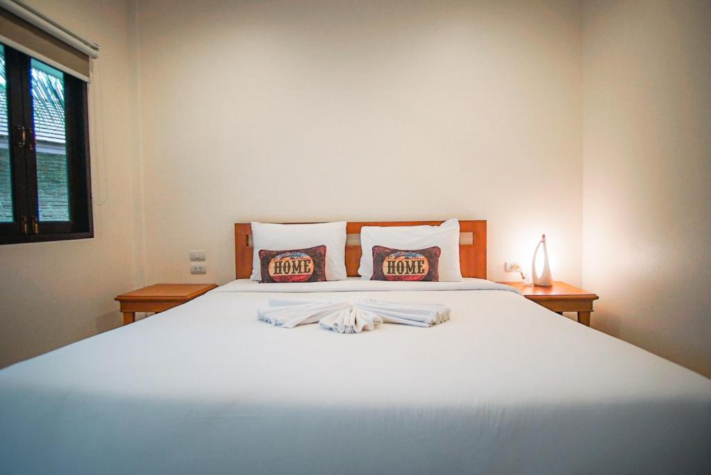Postel nebo postele na pokoji v ubytování Capricorn Village - SHA Extra Plus