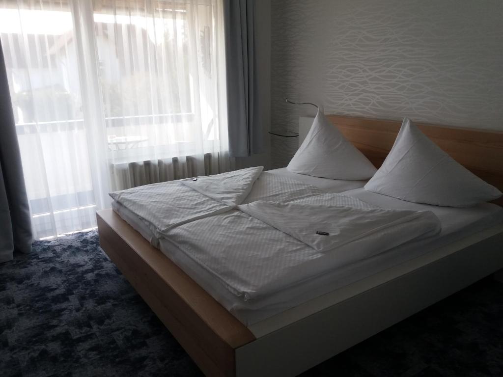 Postel nebo postele na pokoji v ubytování Hotel Garni Waldsegler