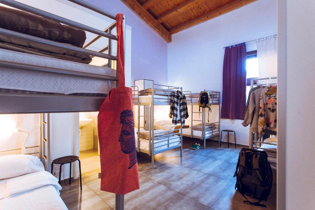 Postel nebo postele na pokoji v ubytování LoL Hostel Siracusa
