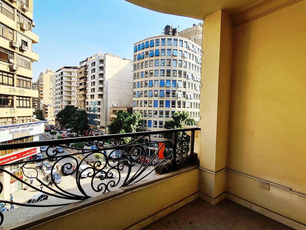 a balcony with a view of a city at Spacious Executive Luxury Apartment with Balcony in Cairo