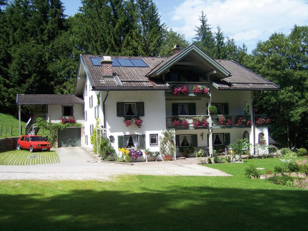 a house with solar panels on the roof at Haus Dufter - Chiemgau Karte in Inzell