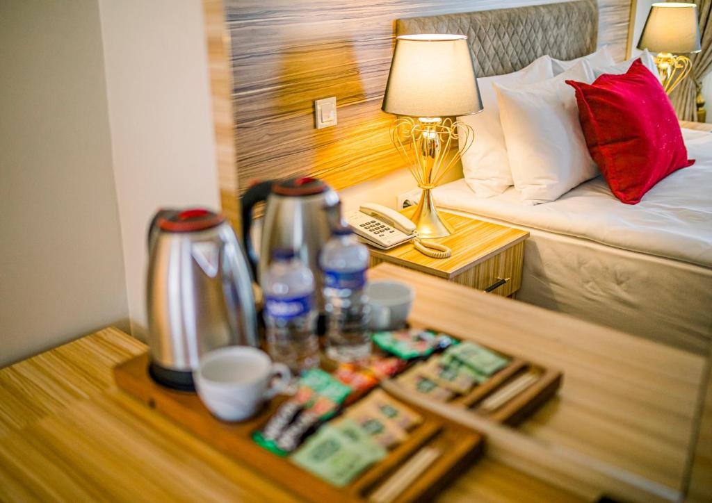 A bed or beds in a room at Gülec Konak Hotel