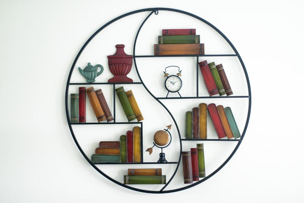 a circle shelf with books and a clock at *Modern 2 Bedroom 2 Bath Apt- Riverside Location* in London