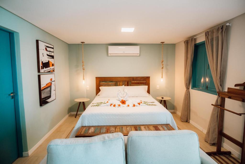 Una cama o camas en una habitación de Catamaran Praia Chalés