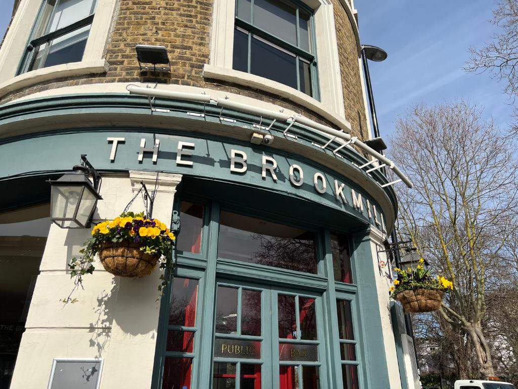 a building with a sign that reads the brooklyn at The Brookmill in London
