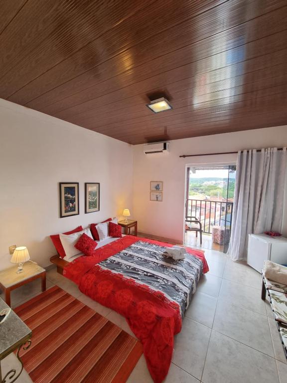 Cama ou camas em um quarto em Pousada Ikabana