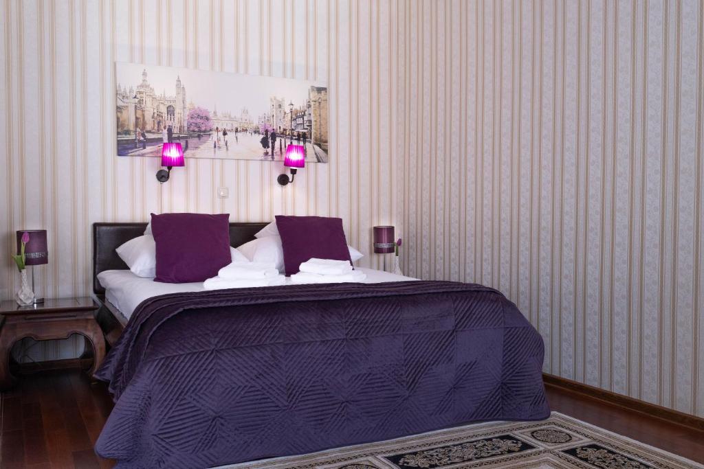 Posteľ alebo postele v izbe v ubytovaní Hotel Wenecki