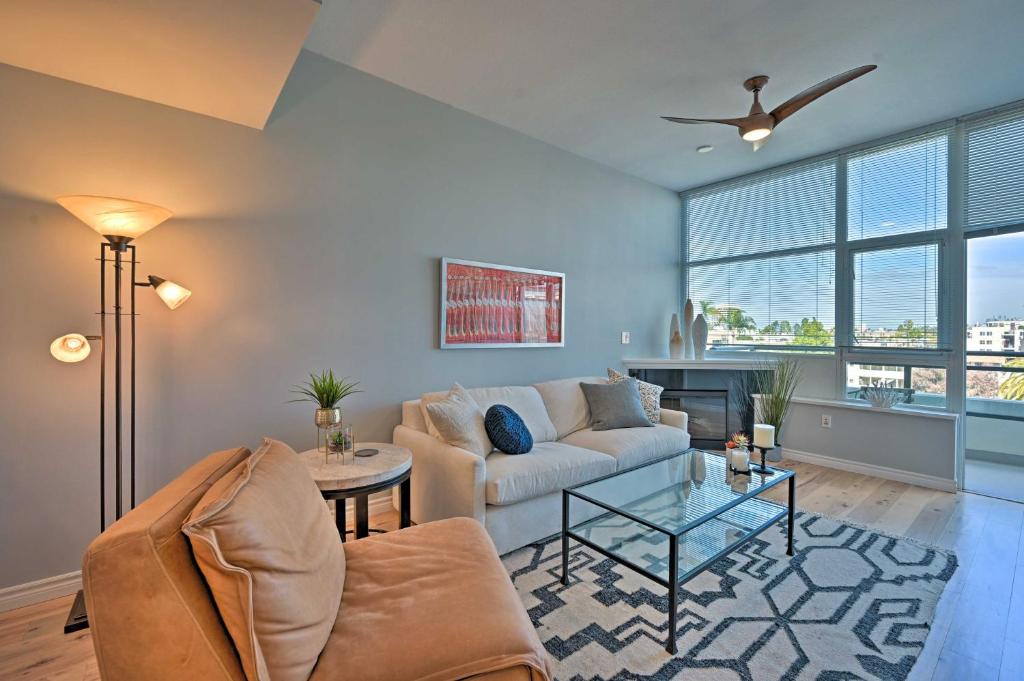 a living room with a couch and a table at Welcoming San Diego Retreat with Balcony! in San Diego