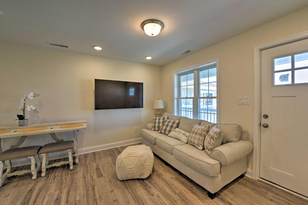 a living room with a couch and a table at Welcoming Wildwood Condo about 1 Block to Beach! in Wildwood
