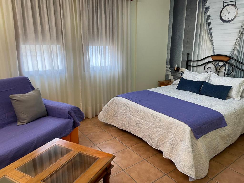 Cama o camas de una habitación en Hotel Hospederia Zacatin