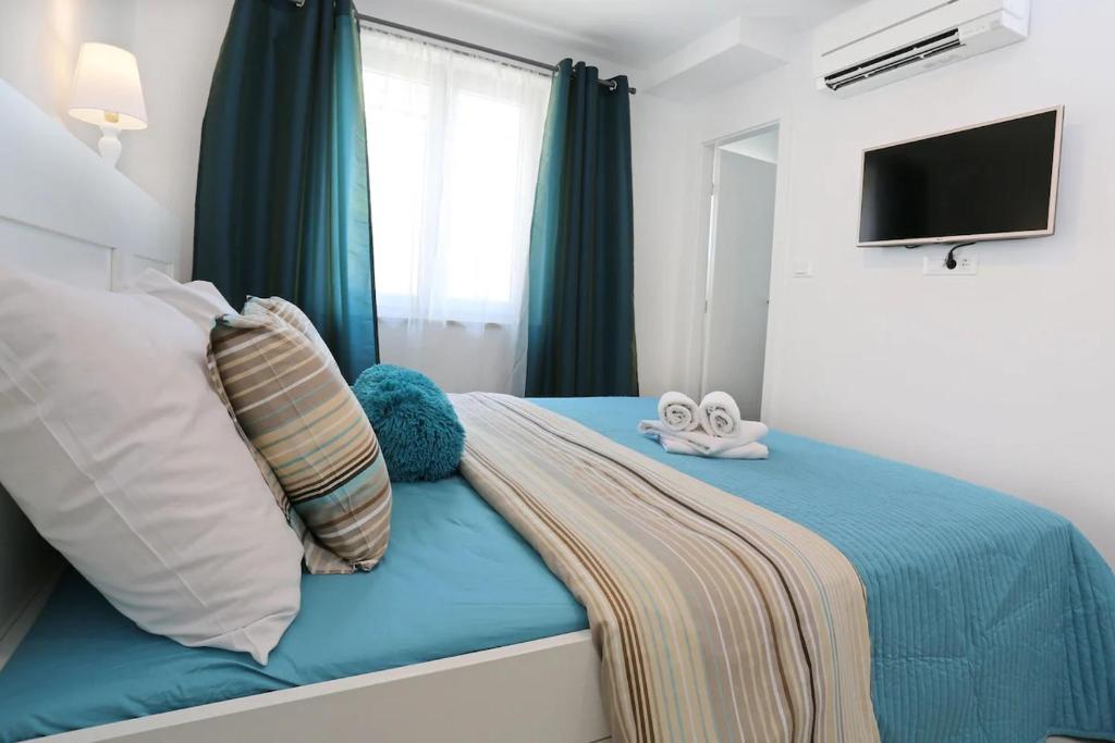 Postel nebo postele na pokoji v ubytování Boutique Hotel Alegria