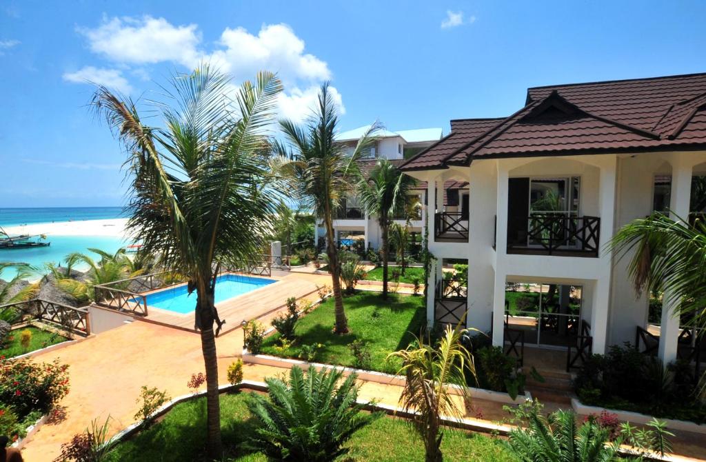 an aerial view of a house and the ocean at Sansi Kendwa Beach Resort in Kendwa