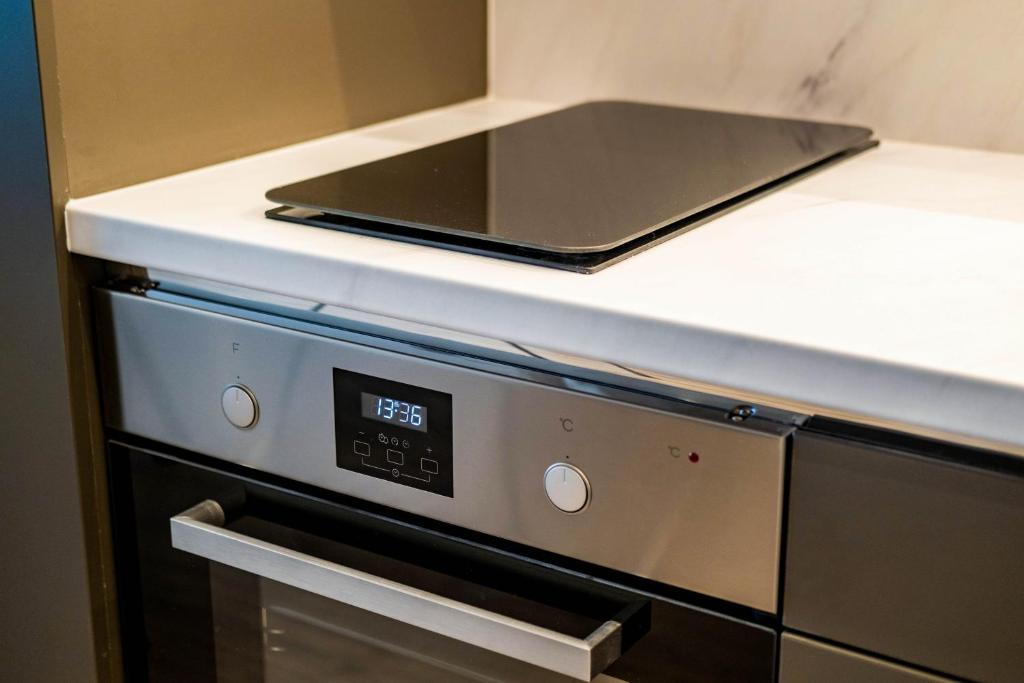 A kitchen or kitchenette at MyFlat Coral Beach Apartment