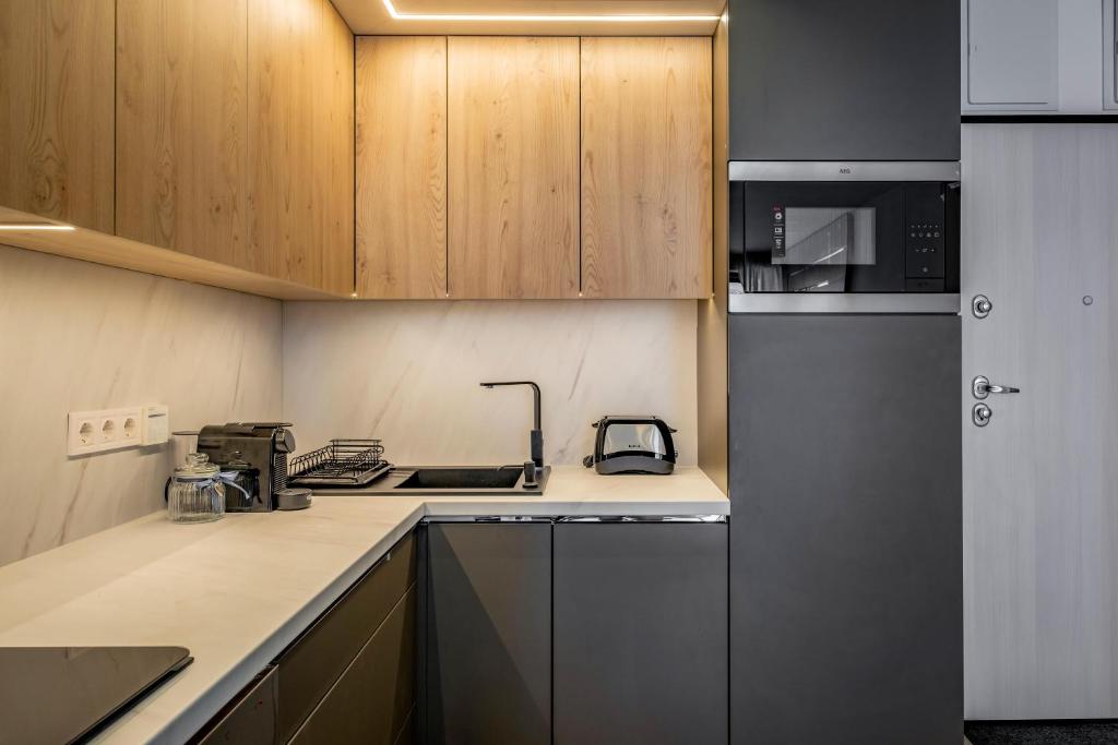 A kitchen or kitchenette at MyFlat Coral Beach Apartment