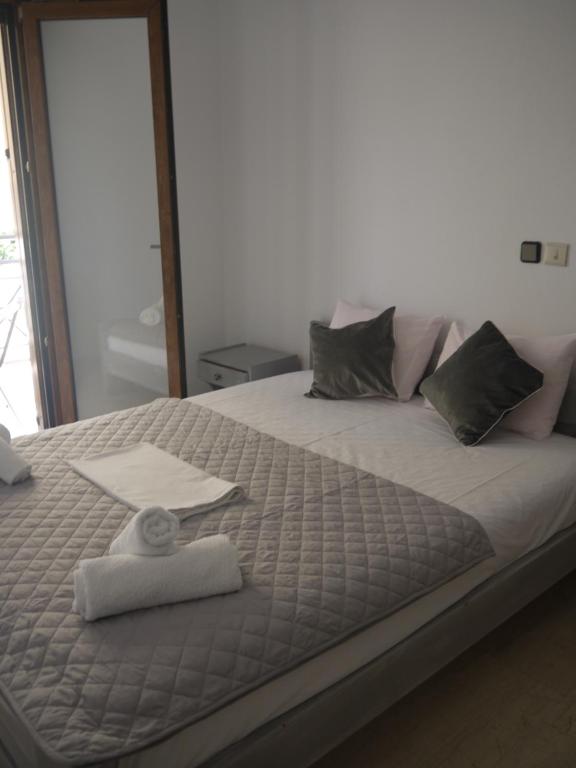 Postel nebo postele na pokoji v ubytování Hotel Akropolis