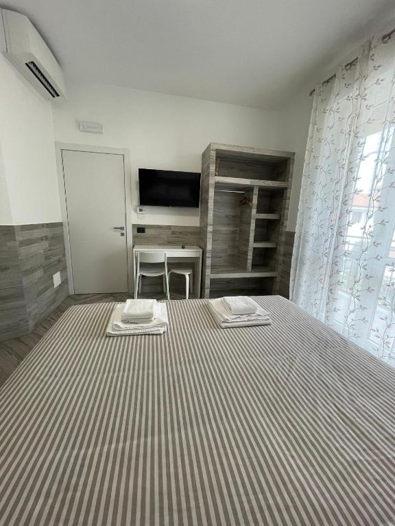 Postel nebo postele na pokoji v ubytování Holiday Rooms Rho