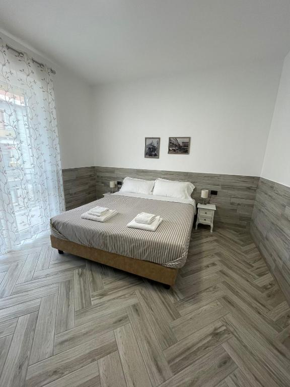 Postel nebo postele na pokoji v ubytování Holiday Rooms Rho
