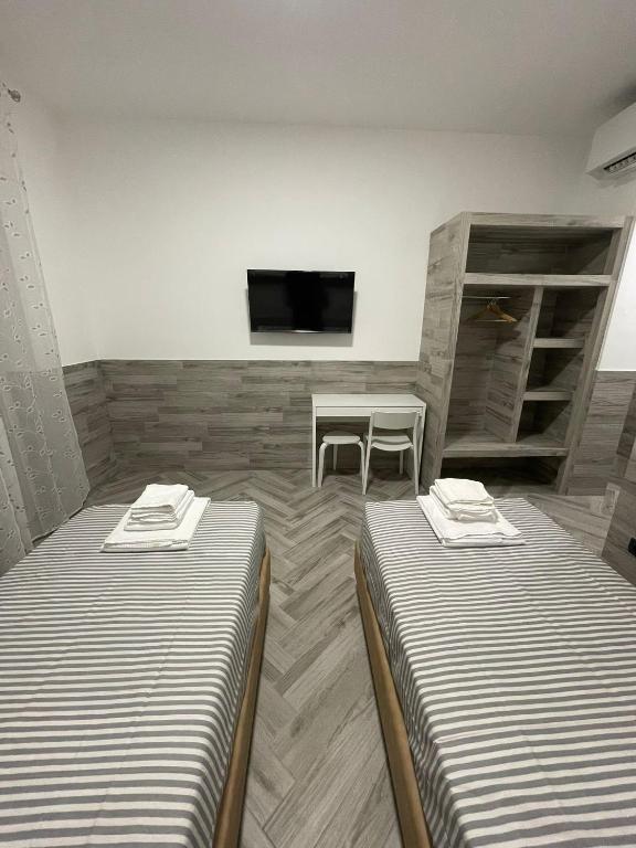 Postel nebo postele na pokoji v ubytování Holiday Rooms Rho