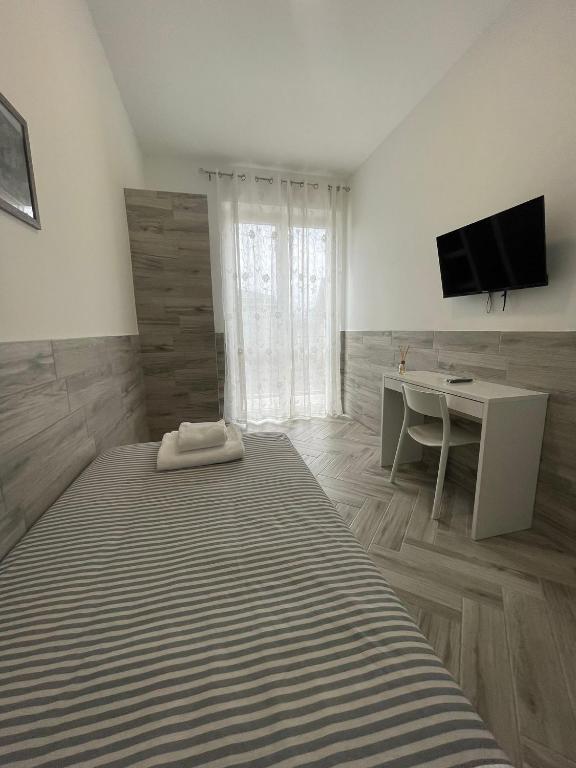 TV a/nebo společenská místnost v ubytování Holiday Rooms Rho