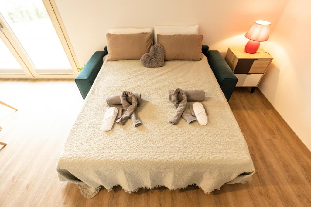 Posteľ alebo postele v izbe v ubytovaní BORGOROMA - Business & Apartments