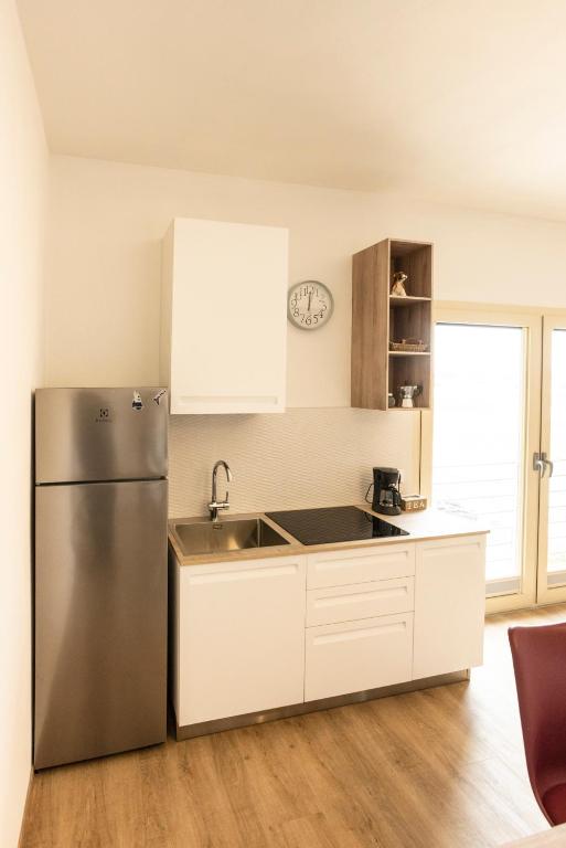 Kuchyňa alebo kuchynka v ubytovaní BORGOROMA - Business & Apartments