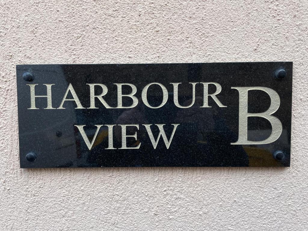 a sign on a wall with the words harrow way at Chandlers BnB in Seahouses