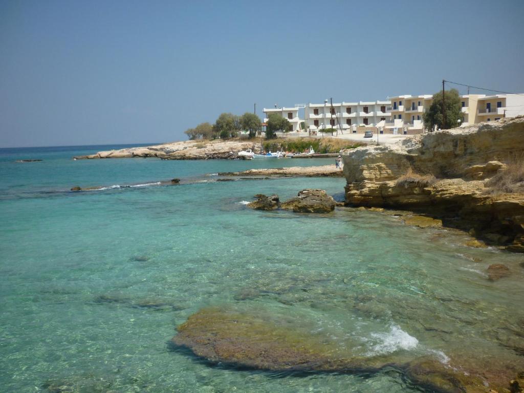 a view of a beach with rocks in the water at Mandalena's in Souvala