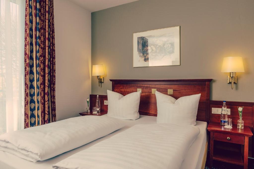 Postel nebo postele na pokoji v ubytování Landhotel Hallnberg