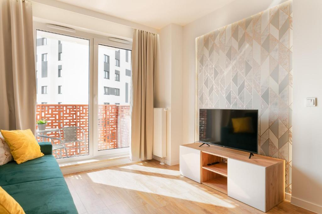 Televízia a/alebo spoločenská miestnosť v ubytovaní South4You Apartments