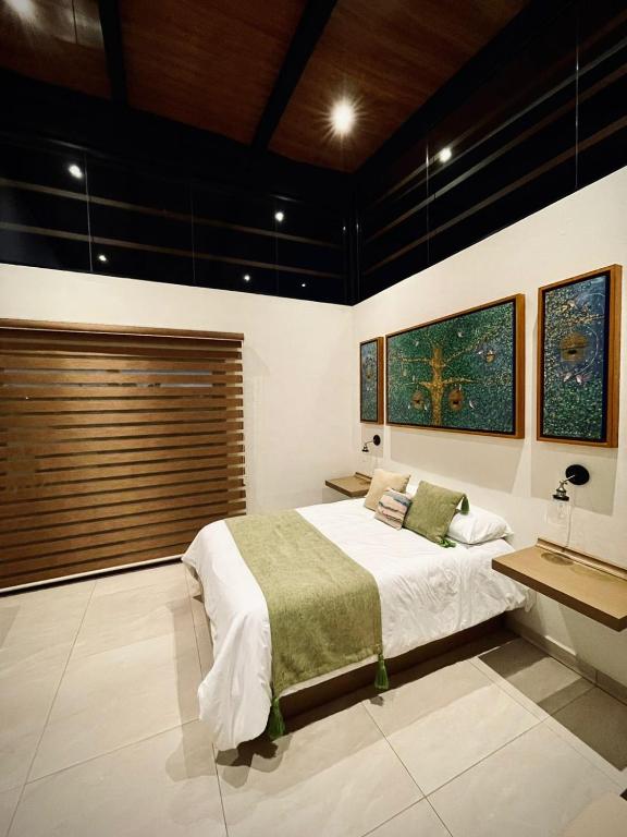 Postel nebo postele na pokoji v ubytování Cabaña Quinta Gaes Spa