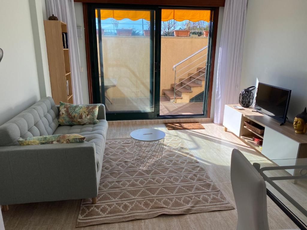 TV a/nebo společenská místnost v ubytování San Vicente do Mar , playa