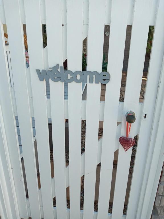 a door with the welcome sign in front of a building at @Echeveria in Montagu