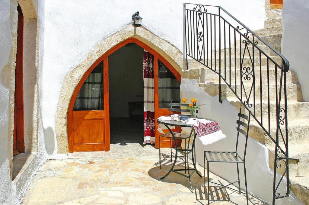 an entrance to a white building with a wooden door at Holiday home in VAFes with heating in Vafés
