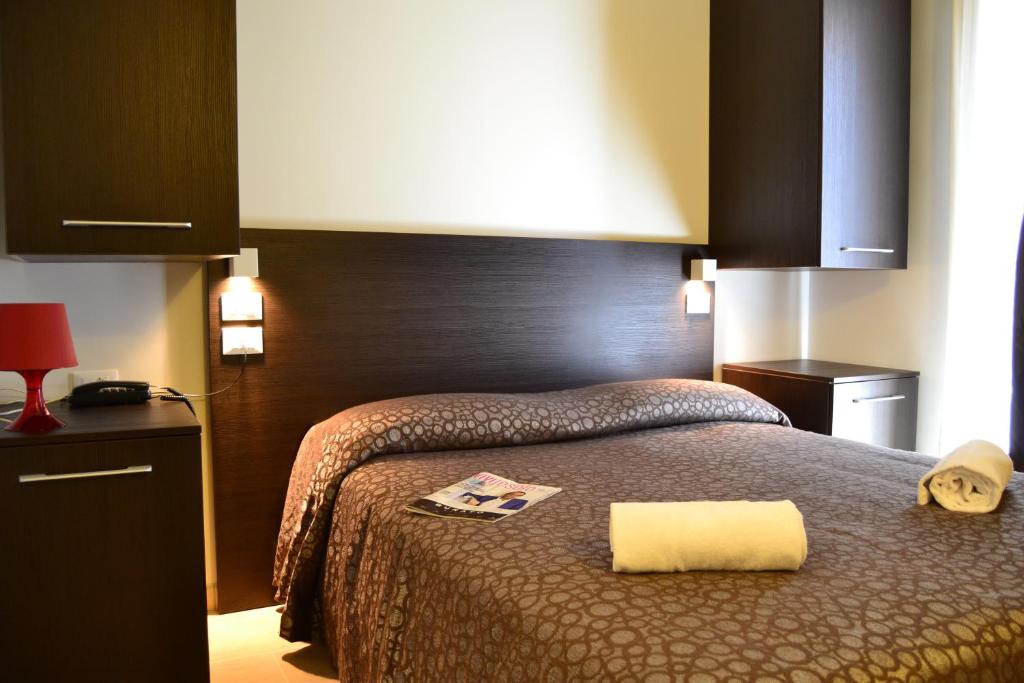 Łóżko lub łóżka w pokoju w obiekcie Hotel Morena