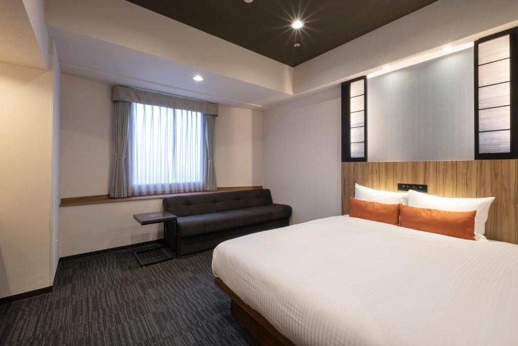 Postel nebo postele na pokoji v ubytování Hundred Stay Tokyo Shinjuku
