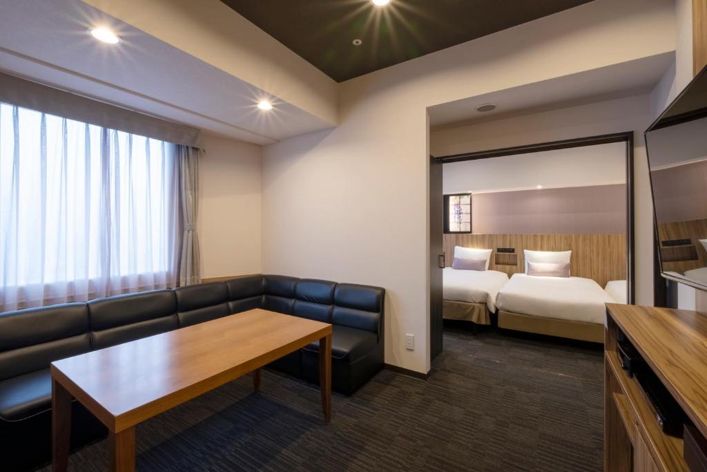 Postel nebo postele na pokoji v ubytování Hundred Stay Tokyo Shinjuku