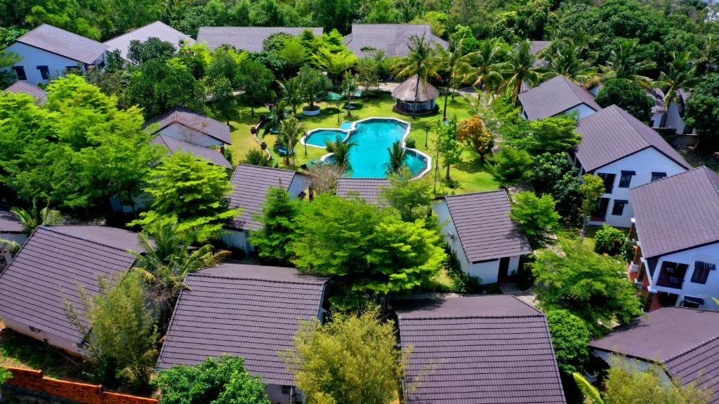 an aerial view of a house with a swimming pool at Santa Garden Resort in Phú Quốc