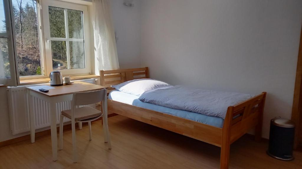 Postel nebo postele na pokoji v ubytování Waldpension Harzer Waldwinkel