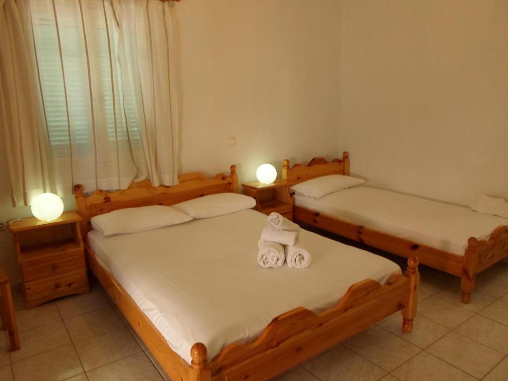 Postel nebo postele na pokoji v ubytování Katerina Apartments